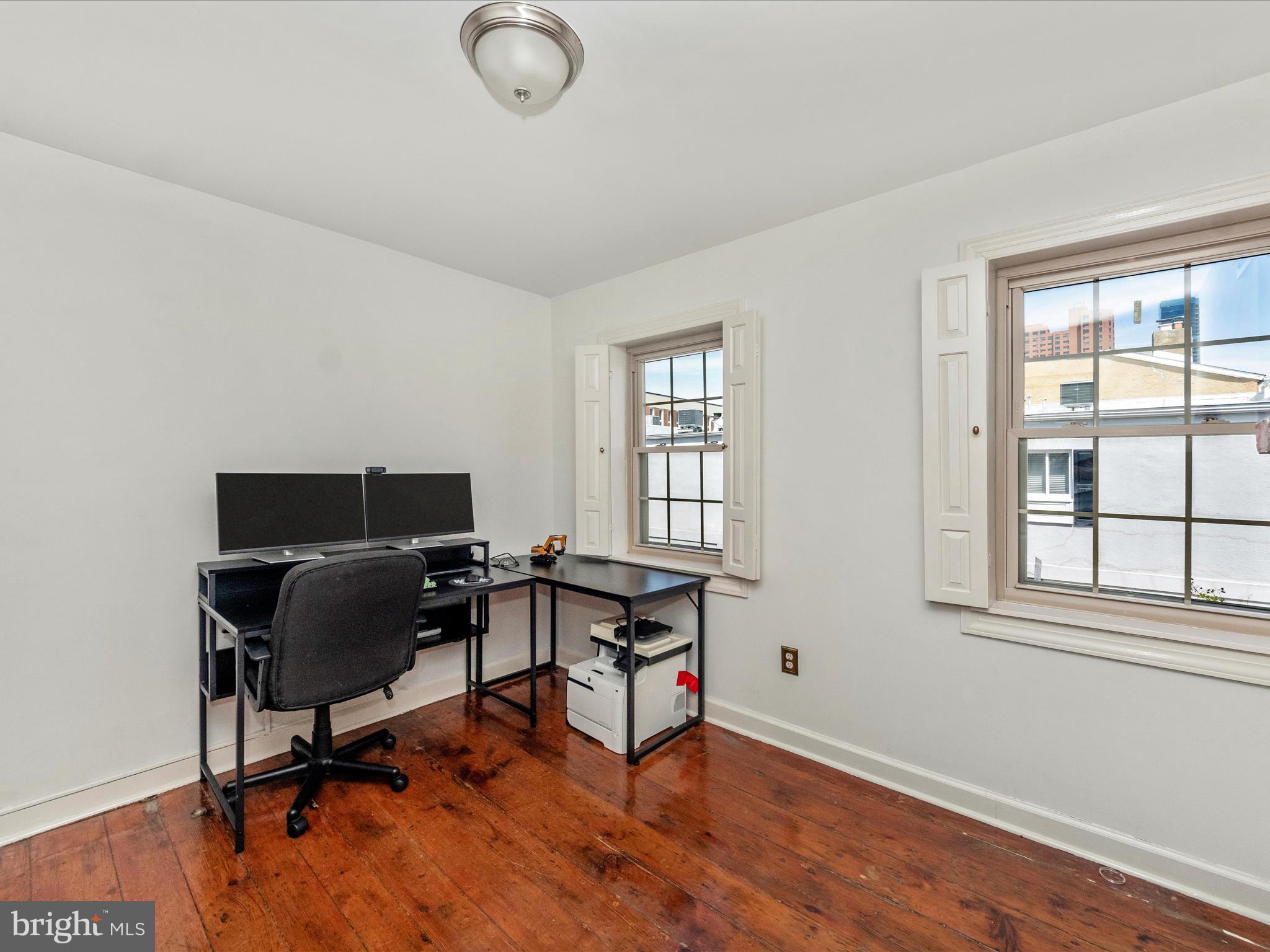 23 East Wheeling Street Baltimore, MD 21230 - Photo 32 of 51 a view of a workspace with furniture and a window