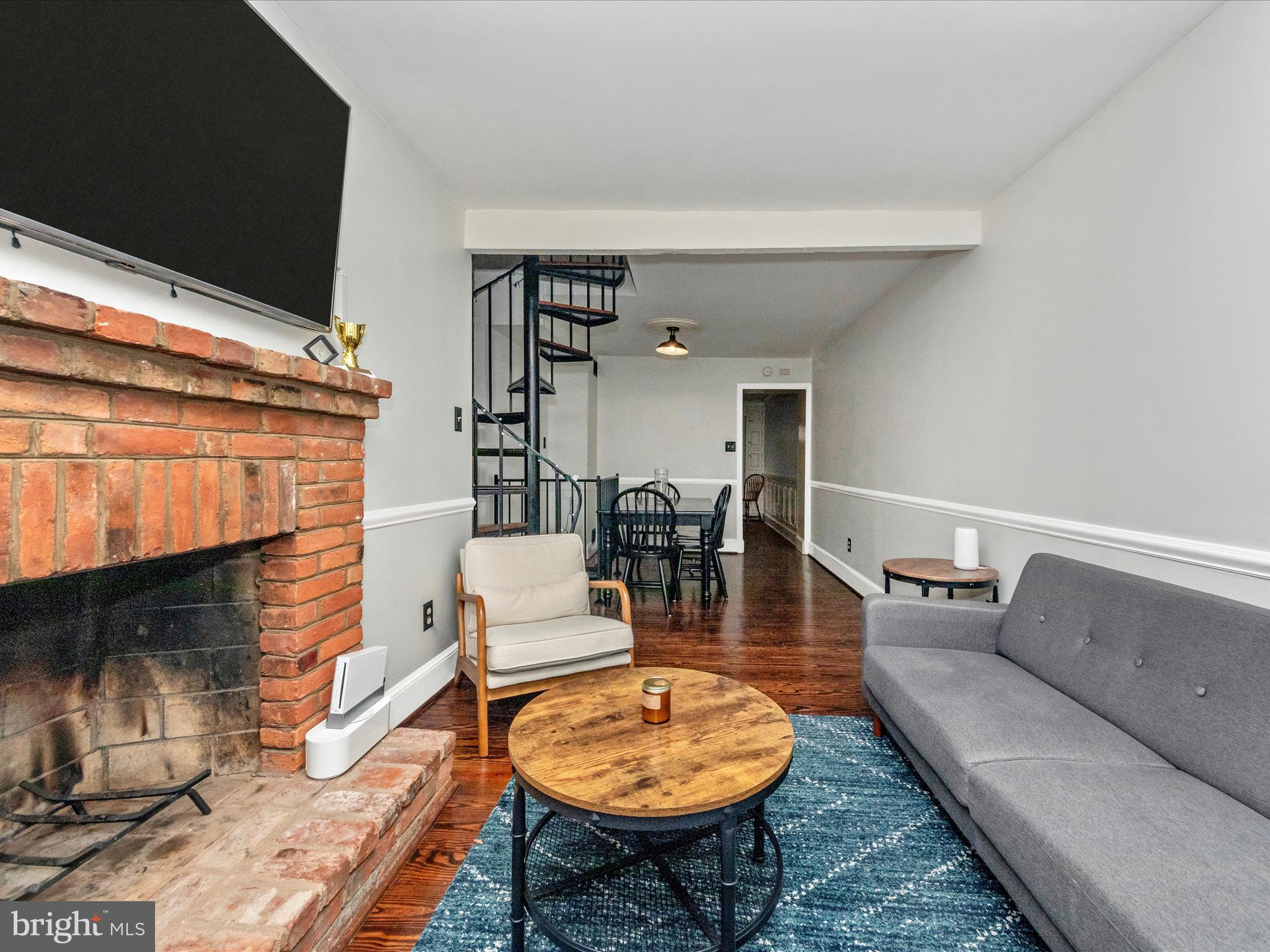 23 East Wheeling Street Baltimore, MD 21230 - Photo 4 of 51 a living room with furniture a rug and a fireplace