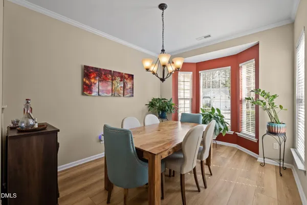 a view of a dining room with furniture window and outside view