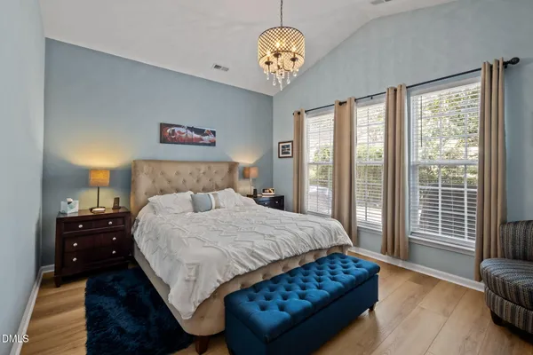 a bedroom with bed and window