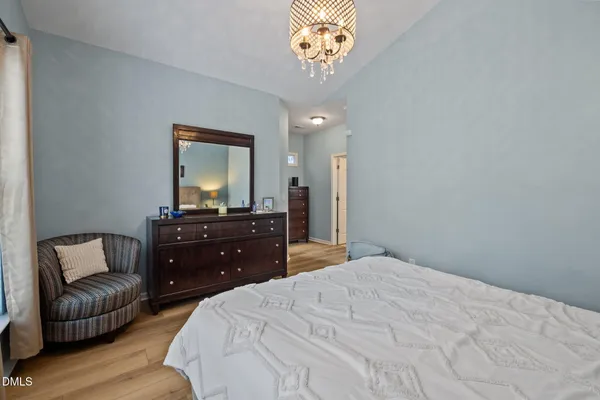 a bedroom with a bed and a couch