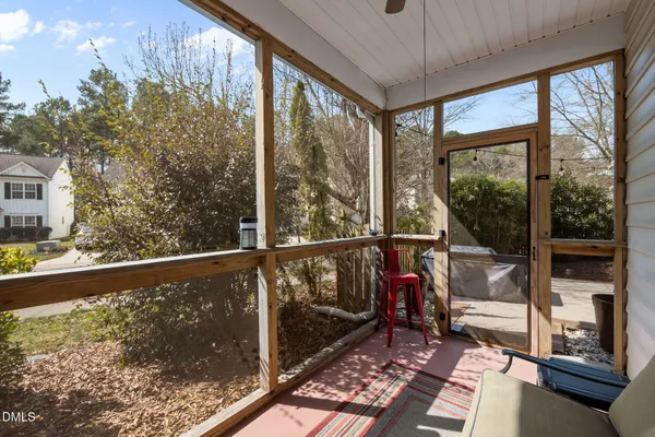 a view of two chairs in the balcony