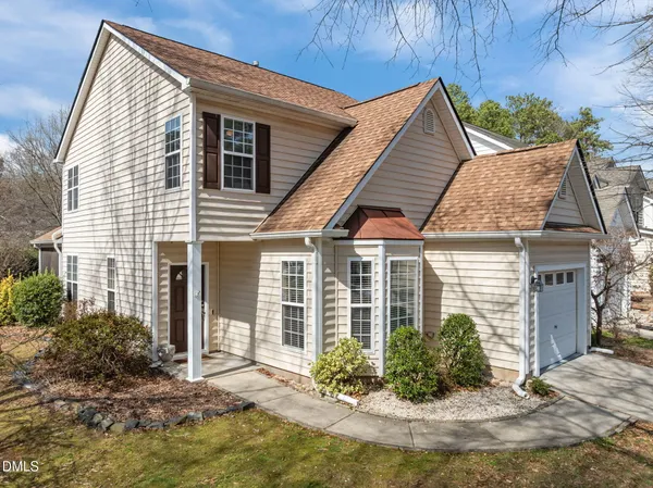 a view of house with yard