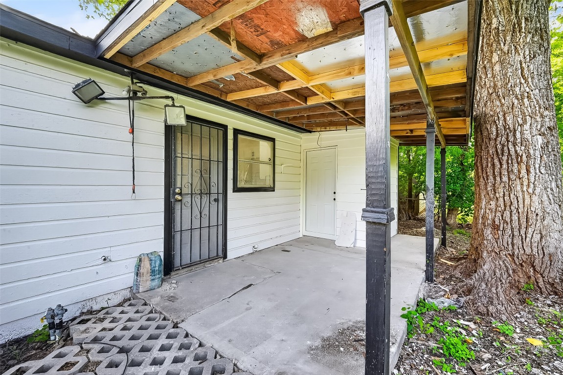 4933 Doolittle Boulevard Houston, TX 77033 - Photo 25 of 28 a view of a porch with a door