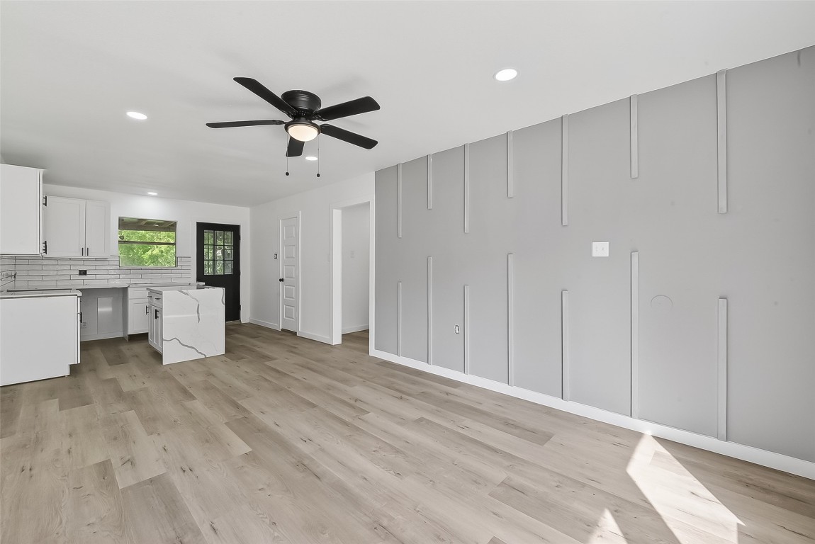 4933 Doolittle Boulevard Houston, TX 77033 - Photo 3 of 28 a view of an empty room with a ceiling fan