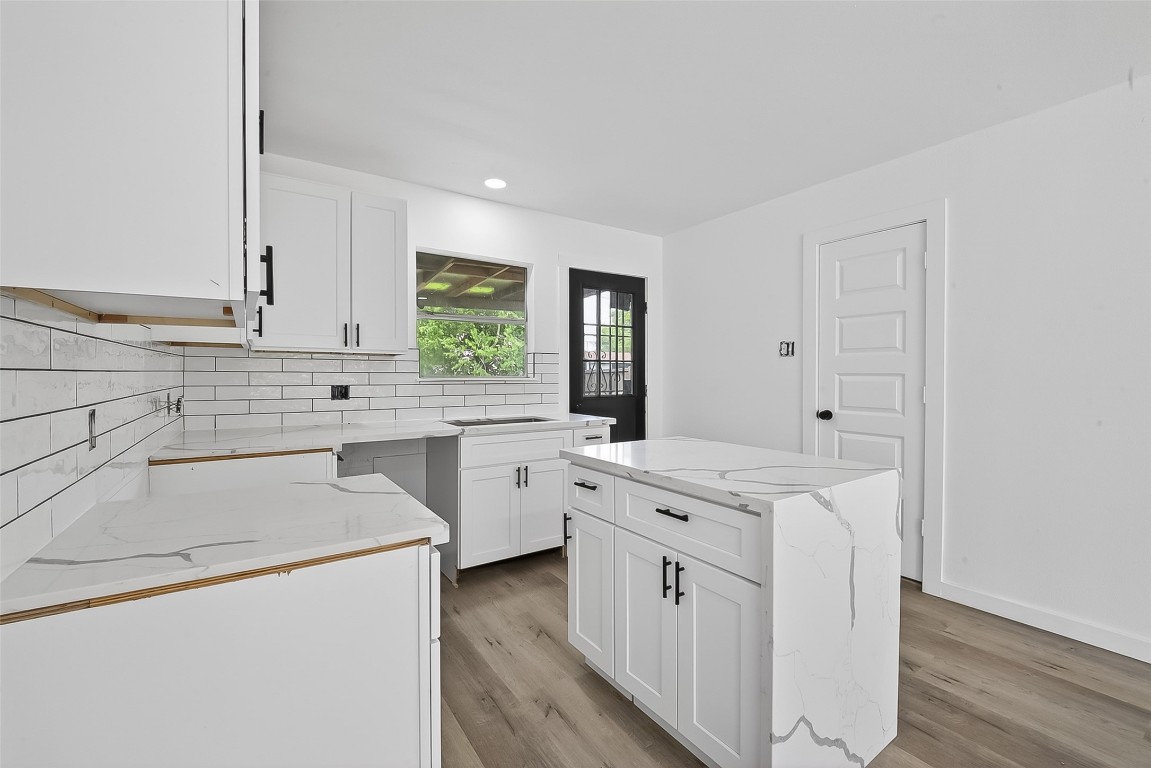 4933 Doolittle Boulevard Houston, TX 77033 - Photo 6 of 28 a kitchen that has a sink and a stove