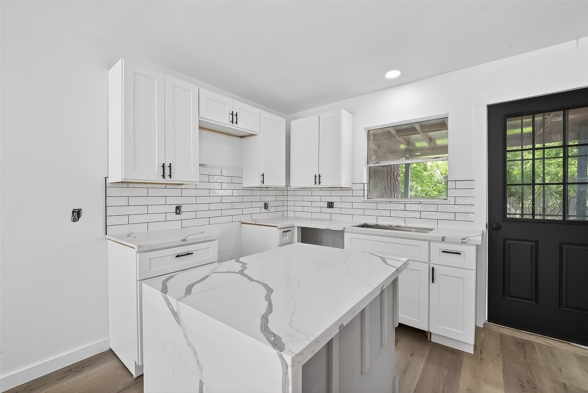 4933 Doolittle Boulevard Houston, TX 77033 - Photo 8 of 28 a view of white cabinets and sink