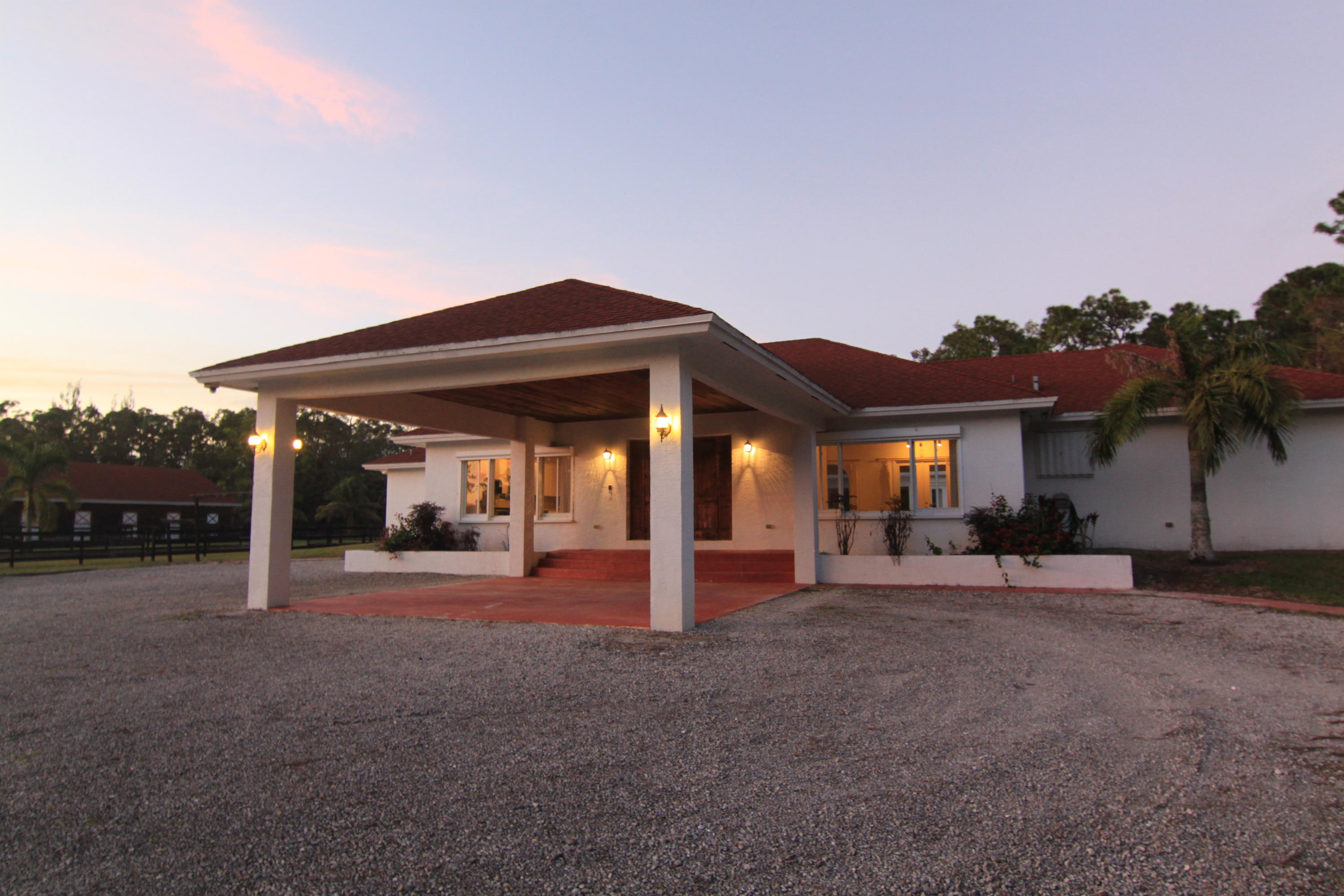 12981 Casey Road Loxahatchee, FL 33470 - Photo 12 of 86 Front of Home W/ Portico