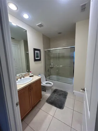 a bathroom with a bathtub sink and toilet