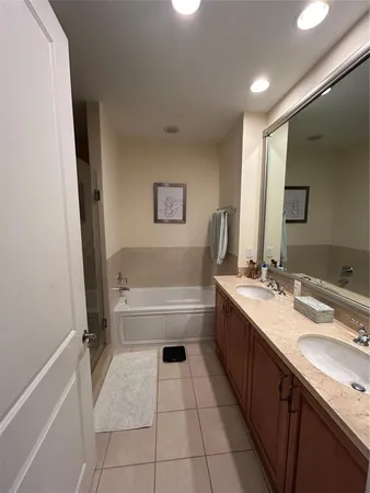 a bathroom with a sink a mirror and a toilet
