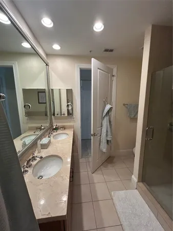 a view of walk in closet with clothes