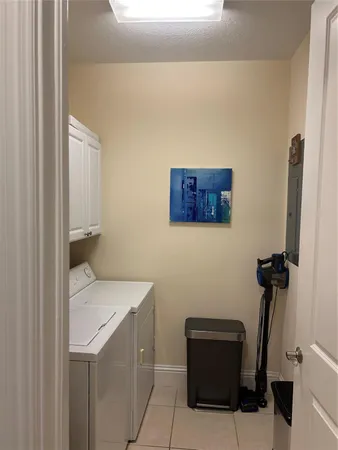 a kitchen with stainless steel appliances granite countertop a sink and a refrigerator