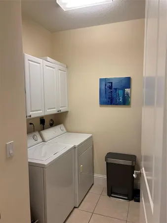 a kitchen with stainless steel appliances granite countertop a sink a stove counter space and cabinets