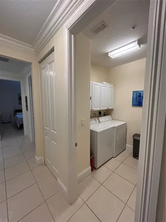 a kitchen with a sink and a stove top oven with wooden floor