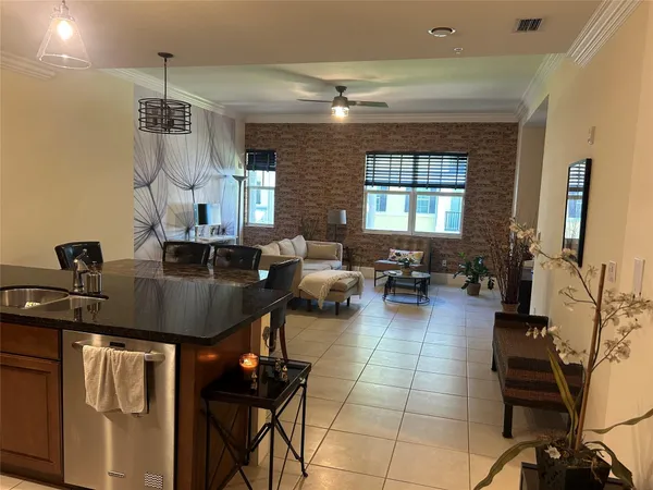 a kitchen with a counter space a sink and appliances
