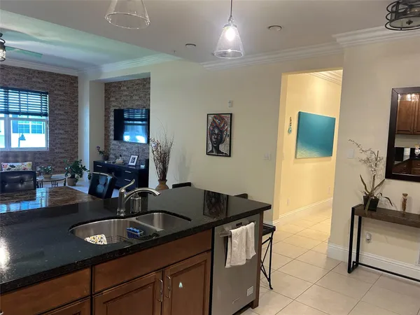 a kitchen with a dining table and chairs