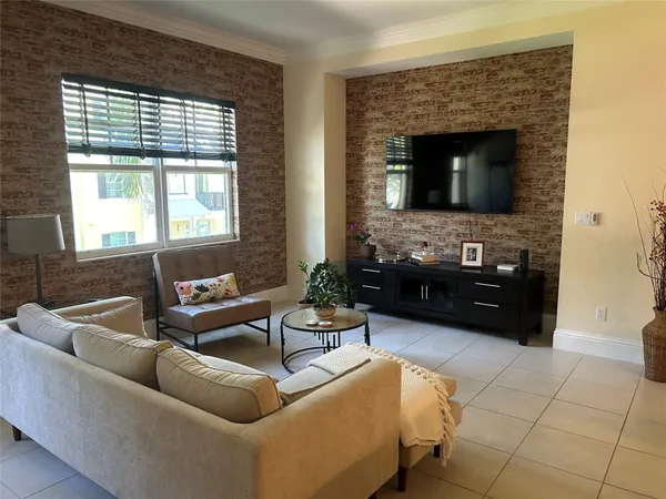 a kitchen with stainless steel appliances kitchen island granite countertop a refrigerator and a wooden cabinets