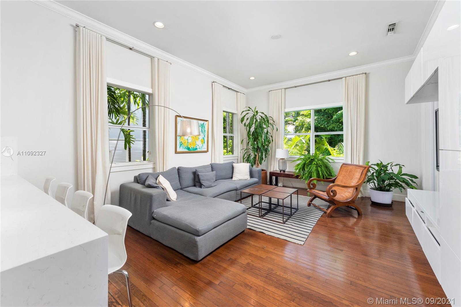 280 Ridgewood Road Key Biscayne, FL 33149 - Photo 11 of 30 a living room with furniture and a large window