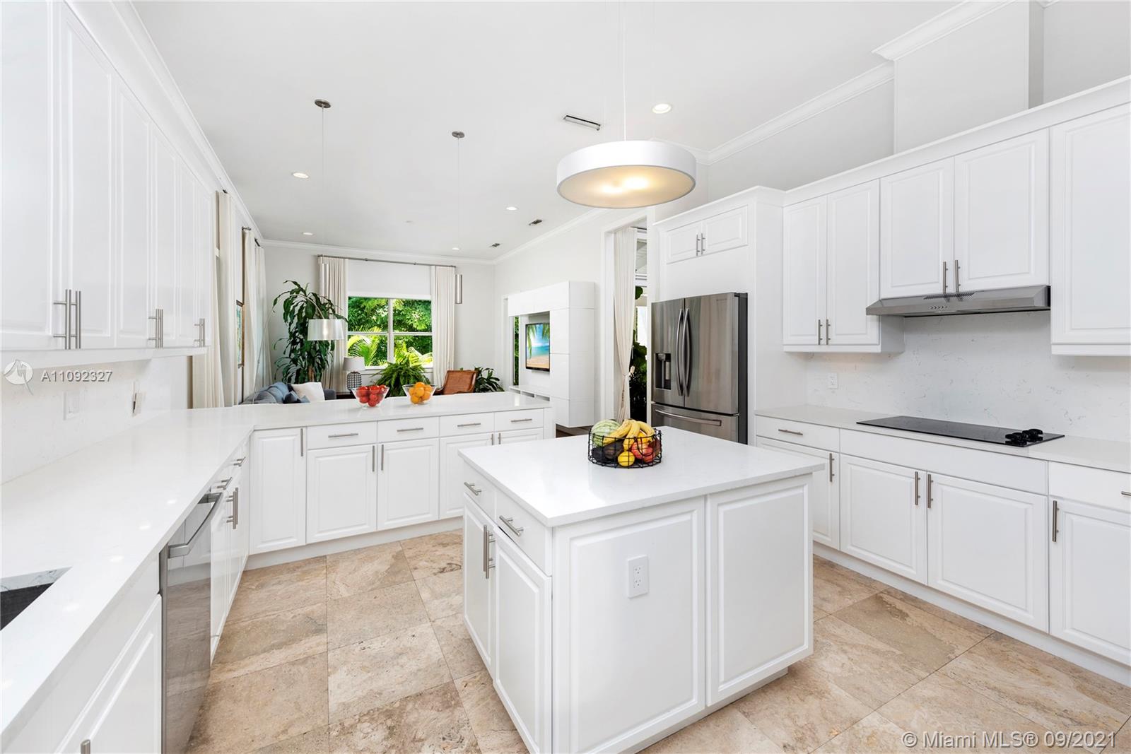280 Ridgewood Road Key Biscayne, FL 33149 - Photo 14 of 30 a kitchen with stainless steel appliances white cabinets and a sink