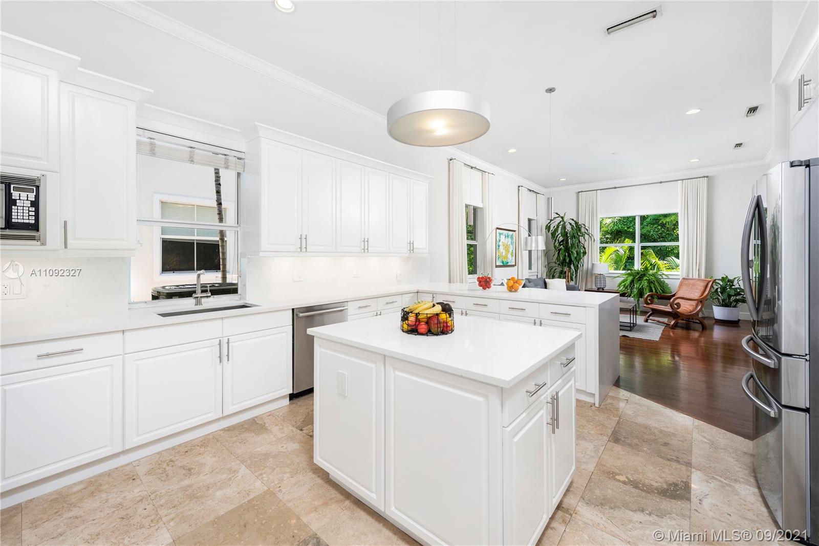 280 Ridgewood Road Key Biscayne, FL 33149 - Photo 15 of 30 a kitchen with a sink stove and cabinets