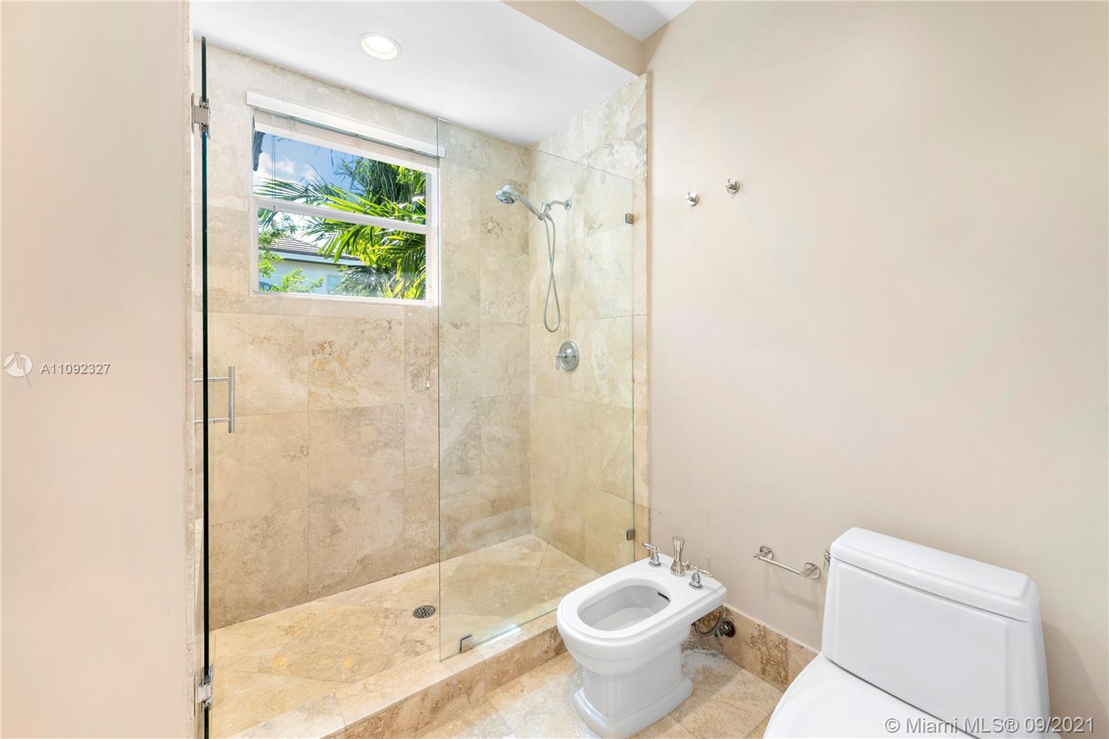 280 Ridgewood Road Key Biscayne, FL 33149 - Photo 20 of 30 a bathroom with a bathtub shower sink and toilet
