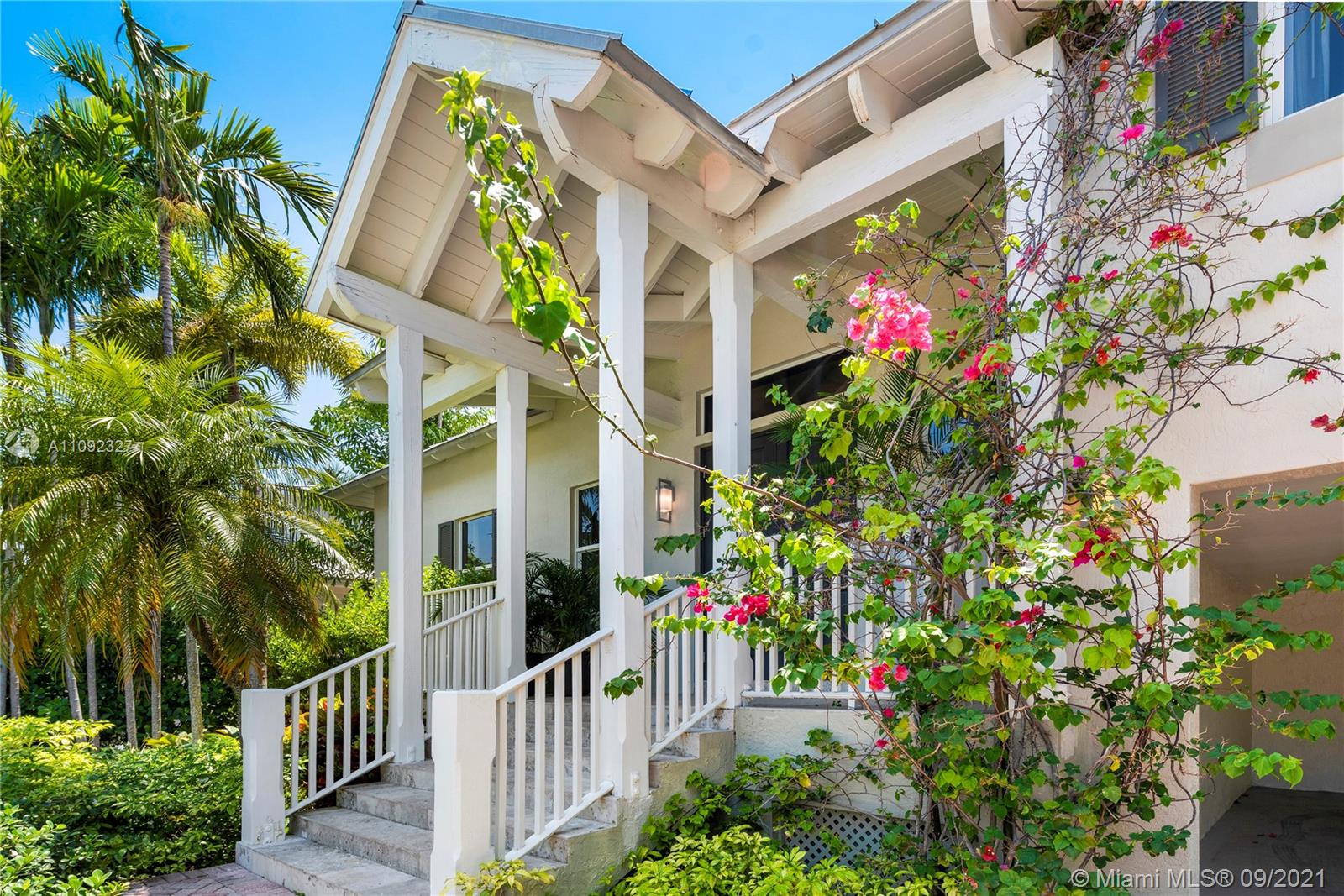 280 Ridgewood Road Key Biscayne, FL 33149 - Photo 3 of 30 a flower plants in front of a house