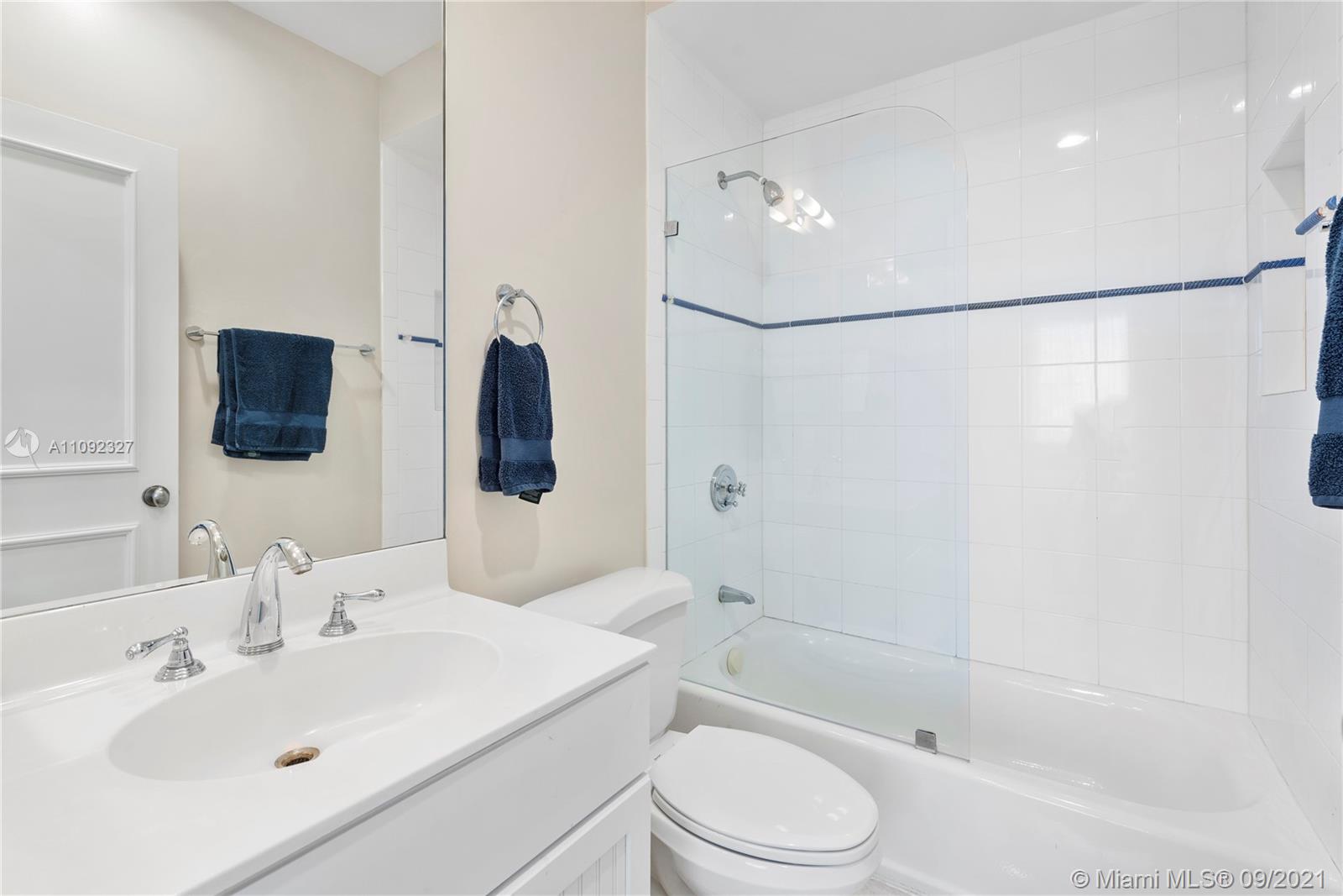 280 Ridgewood Road Key Biscayne, FL 33149 - Photo 22 of 30 a bathroom with a sink toilet and shower