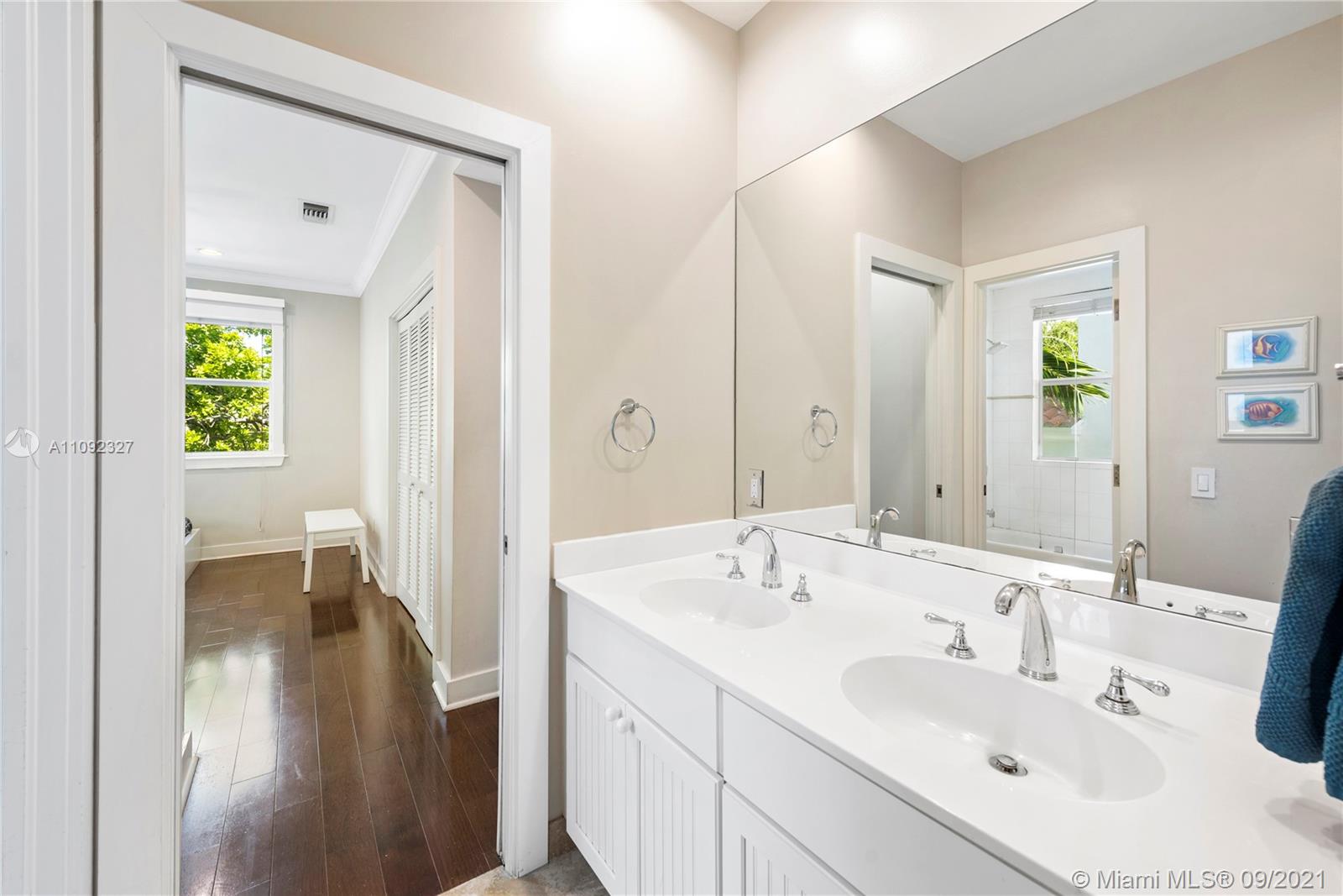 280 Ridgewood Road Key Biscayne, FL 33149 - Photo 25 of 30 a bathroom with a sink and a mirror