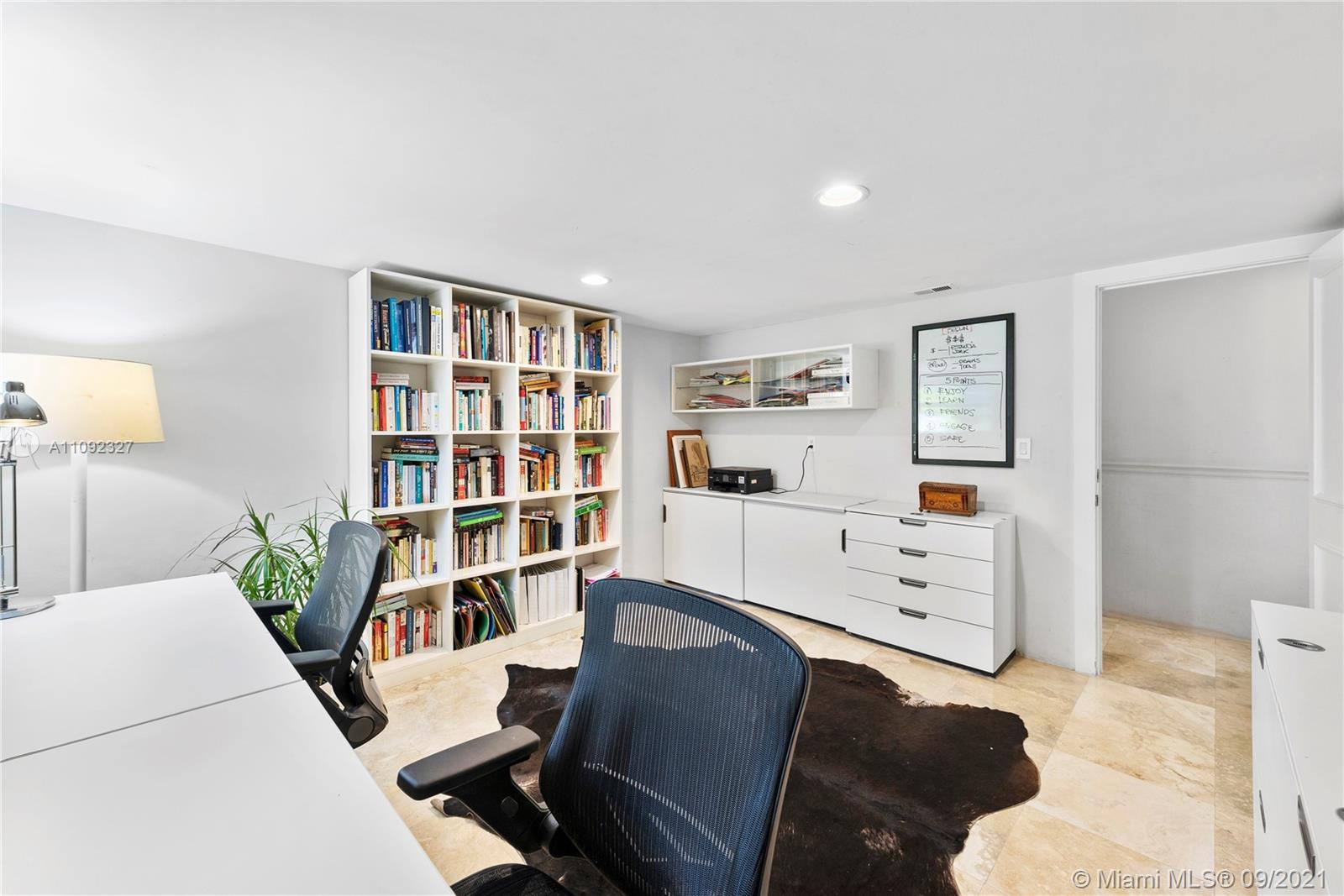 280 Ridgewood Road Key Biscayne, FL 33149 - Photo 26 of 30 a view of a workspace with furniture and a bookshelf