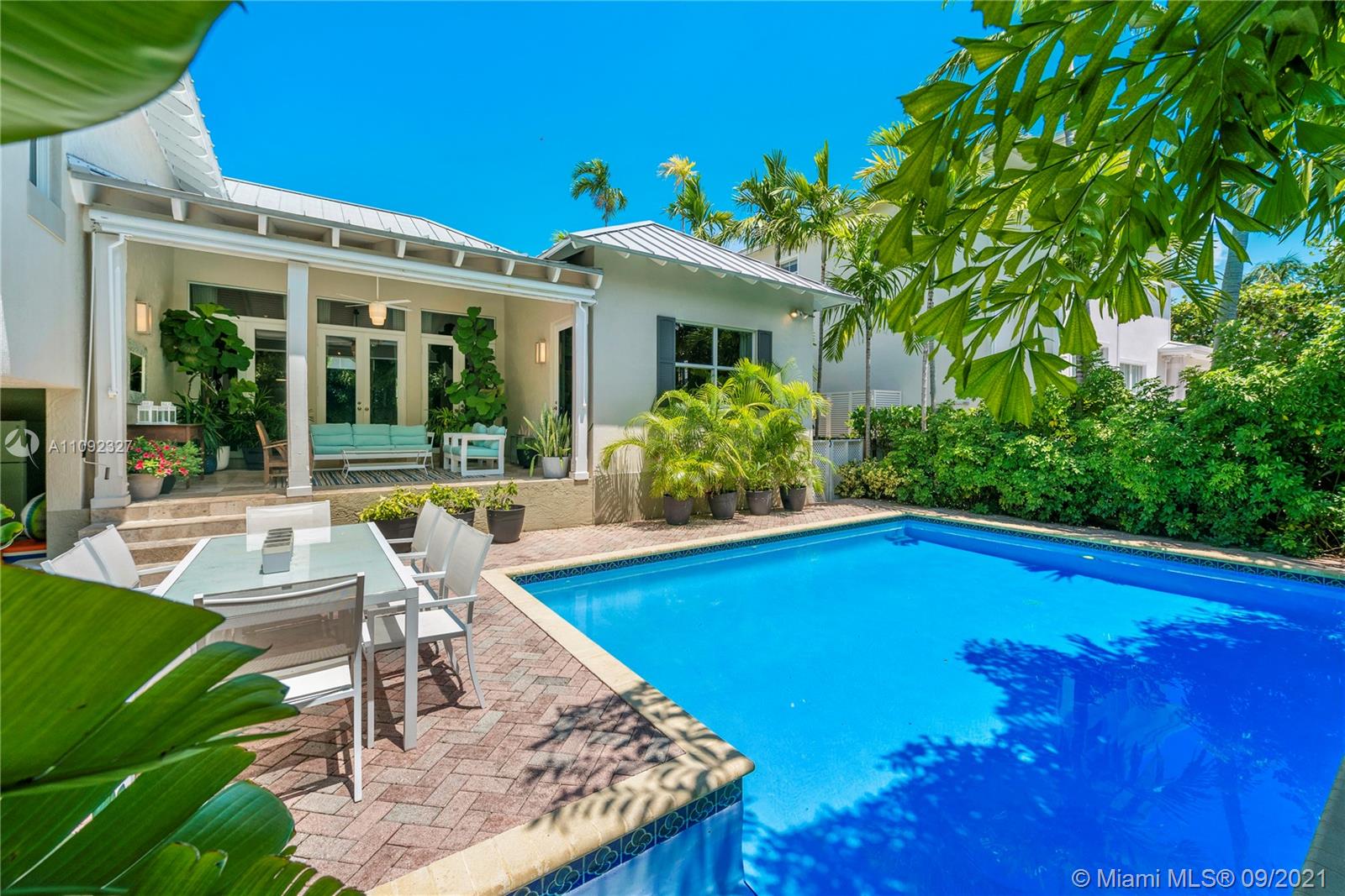 280 Ridgewood Road Key Biscayne, FL 33149 - Photo 5 of 30 a view of a house with swimming pool and sitting area