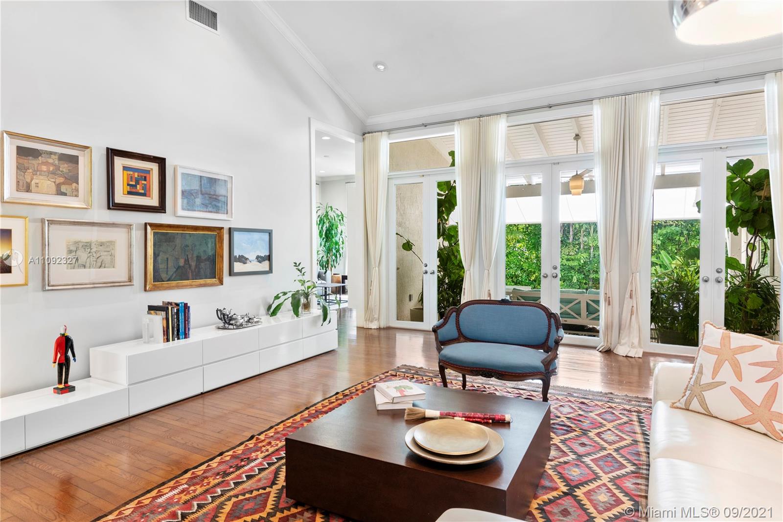280 Ridgewood Road Key Biscayne, FL 33149 - Photo 7 of 30 a living room with furniture and floor to ceiling windows