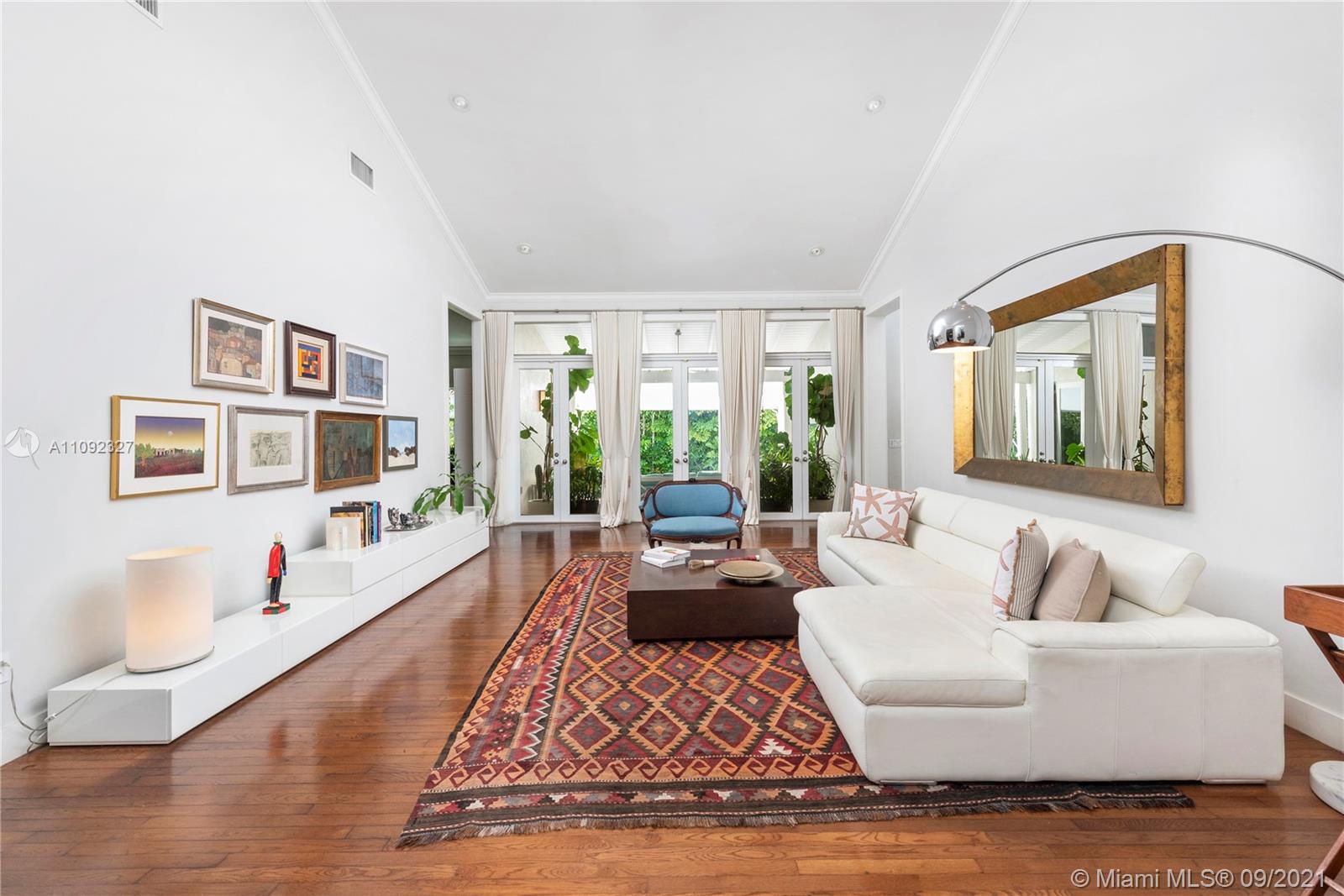 280 Ridgewood Road Key Biscayne, FL 33149 - Photo 8 of 30 a living room with furniture and a large window
