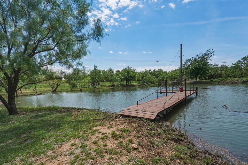 432 Clark Road Abilene, TX 79602 - Photo 3 of 40 a view of a lake with boats and trees in the background