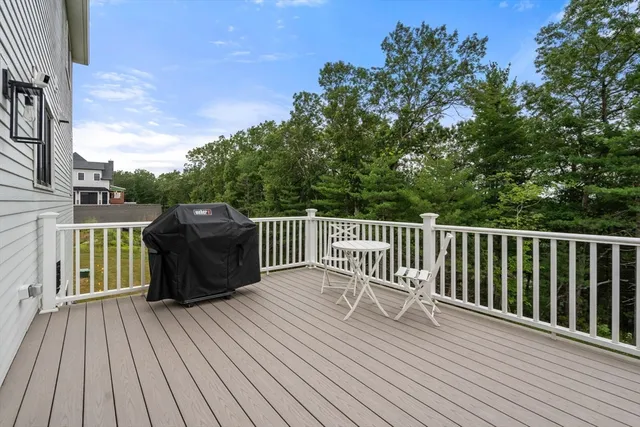 a view of deck with wooden floor and fence