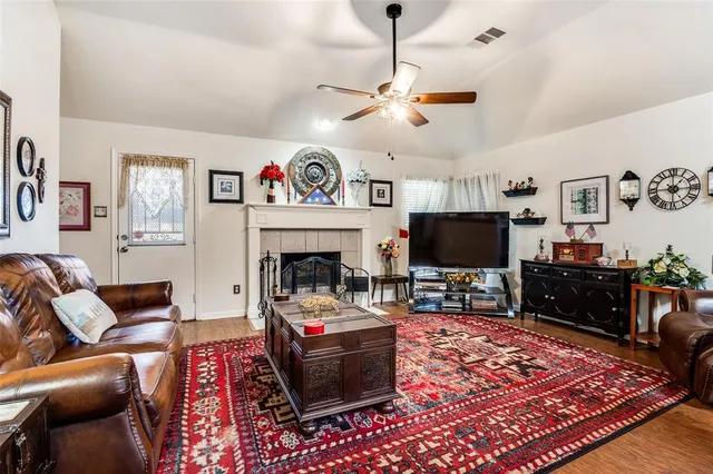 a living room with furniture and a fireplace