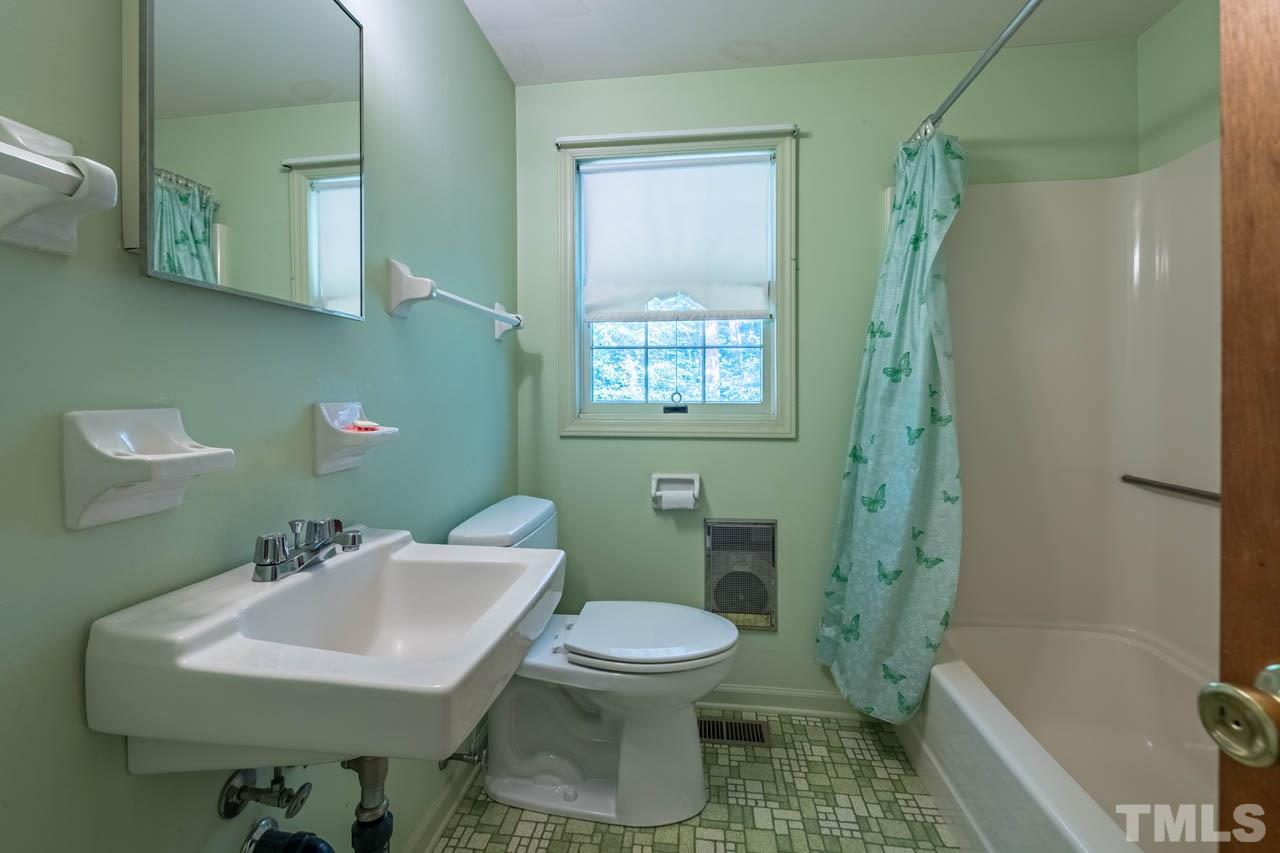 3715 Bahama Road Rougemont, NC 27572 - Photo 16 of 30 a bathroom with a sink toilet and shower