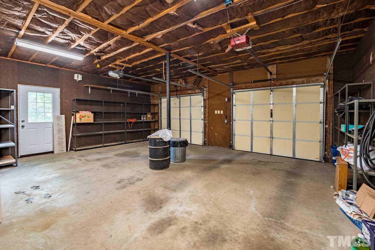 3715 Bahama Road Rougemont, NC 27572 - Photo 24 of 30 a view of a room with storage and racks