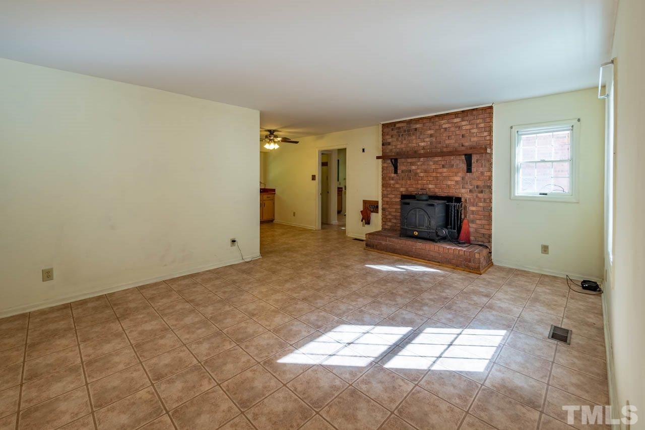 3715 Bahama Road Rougemont, NC 27572 - Photo 6 of 30 a view of empty room with a fireplace