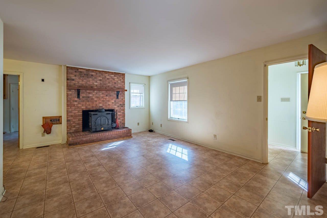 3715 Bahama Road Rougemont, NC 27572 - Photo 7 of 30 a view of empty room with a fireplace