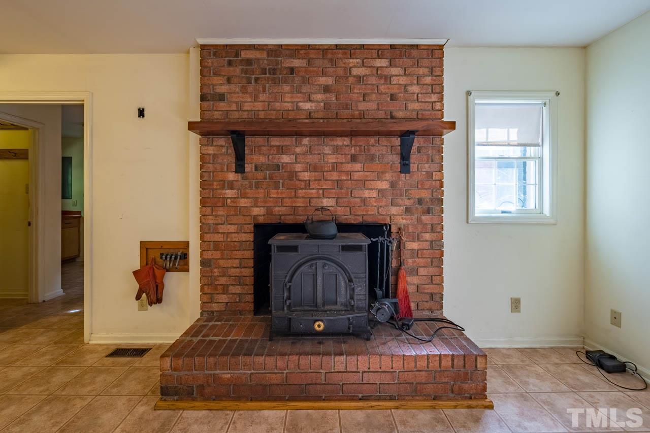 3715 Bahama Road Rougemont, NC 27572 - Photo 8 of 30 a living room with furniture and a fireplace