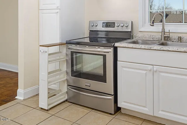 a kitchen with a stove and a sink