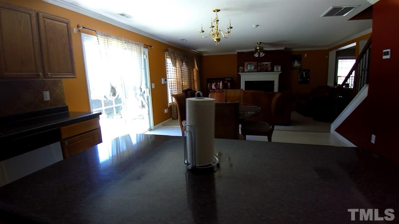 4028 Oatgrass Lane Raleigh, NC 27604 - Photo 6 of 8 a view of a living room with furniture and a window