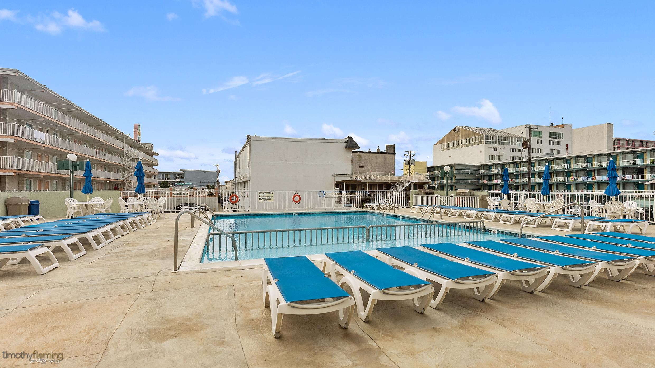 225 East Wildwood Avenue, Unit 505 Wildwood, NJ 08260 - Photo 19 of 24 a swimming pool with outdoor seating and city view