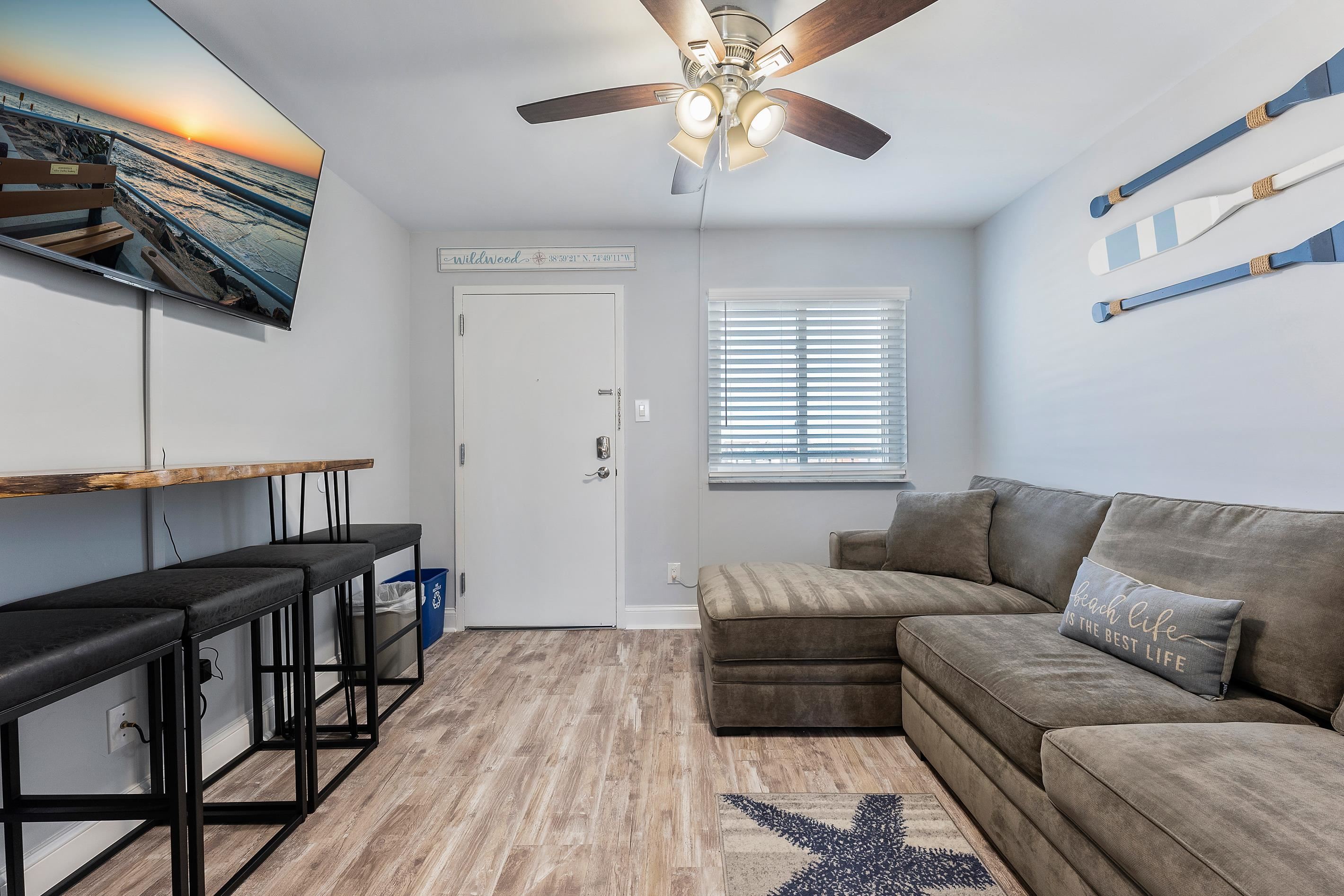 225 East Wildwood Avenue, Unit 505 Wildwood, NJ 08260 - Photo 9 of 24 a living room with furniture and a wooden floor