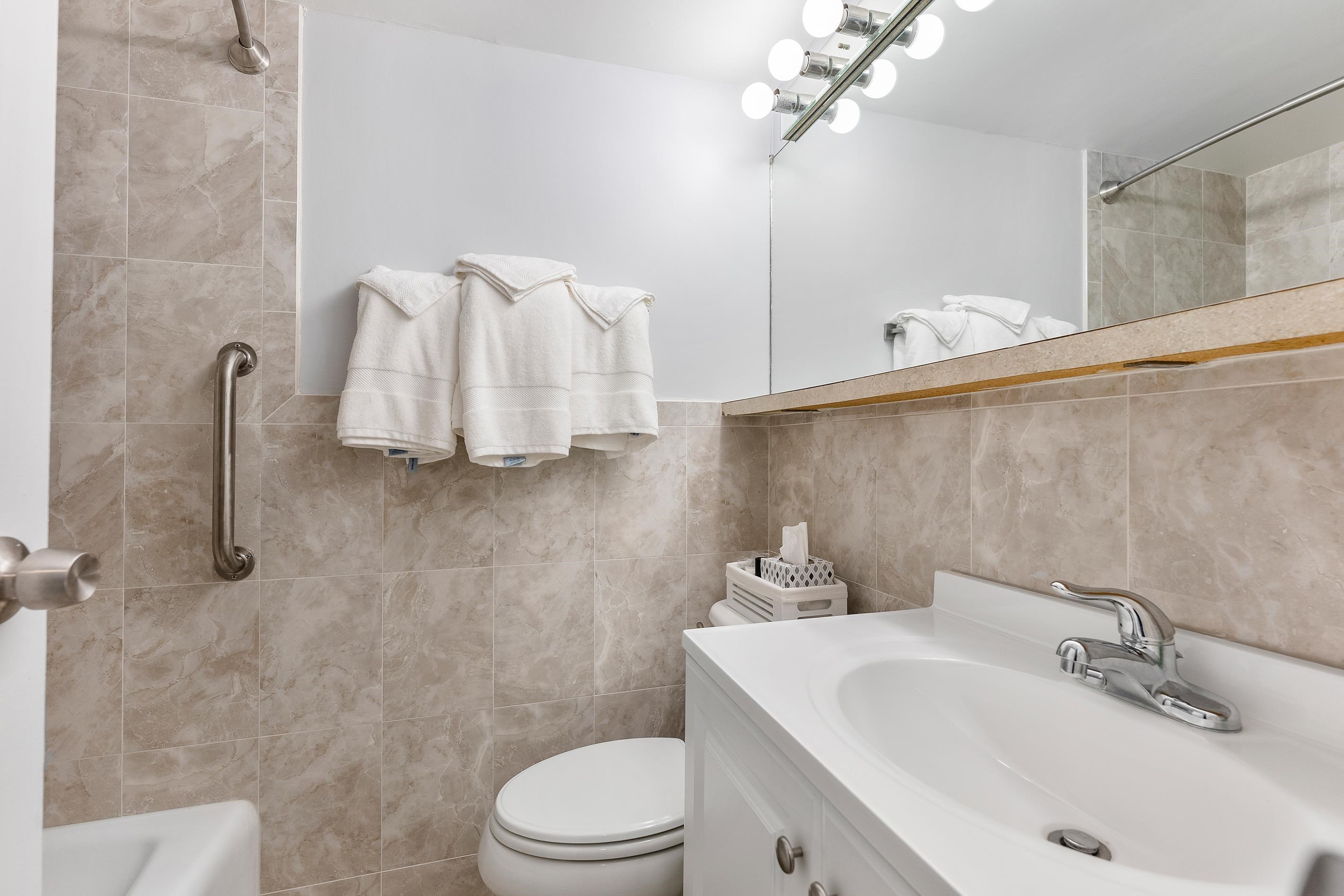 225 East Wildwood Avenue, Unit 505 Wildwood, NJ 08260 - Photo 10 of 24 a bathroom with a sink a toilet and shower