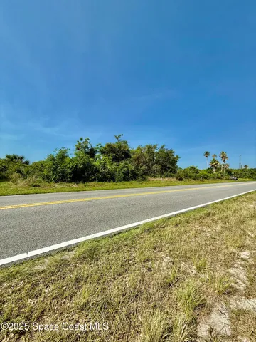 a view of an ocean and a mountain