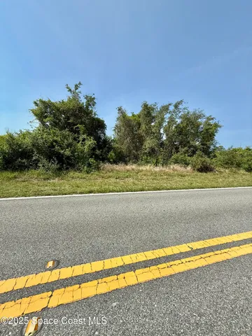 a view of a yard with an outdoor space