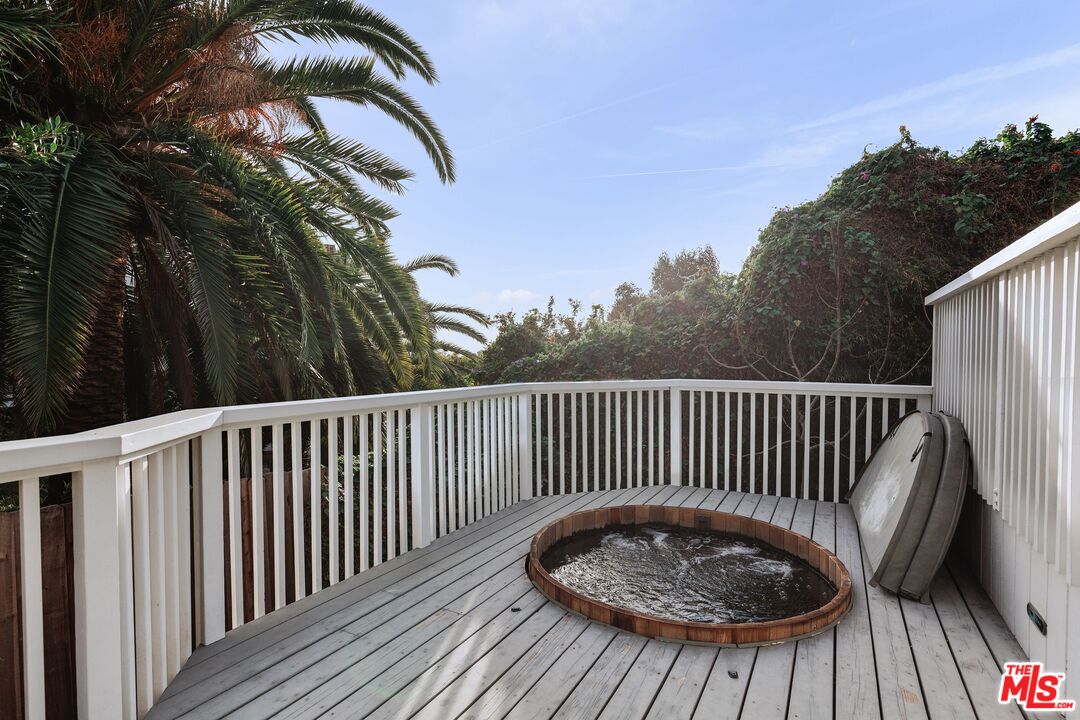 3629 Serra Road Malibu, CA 90265 - Photo 20 of 26 a view of balcony with wooden floor and fence