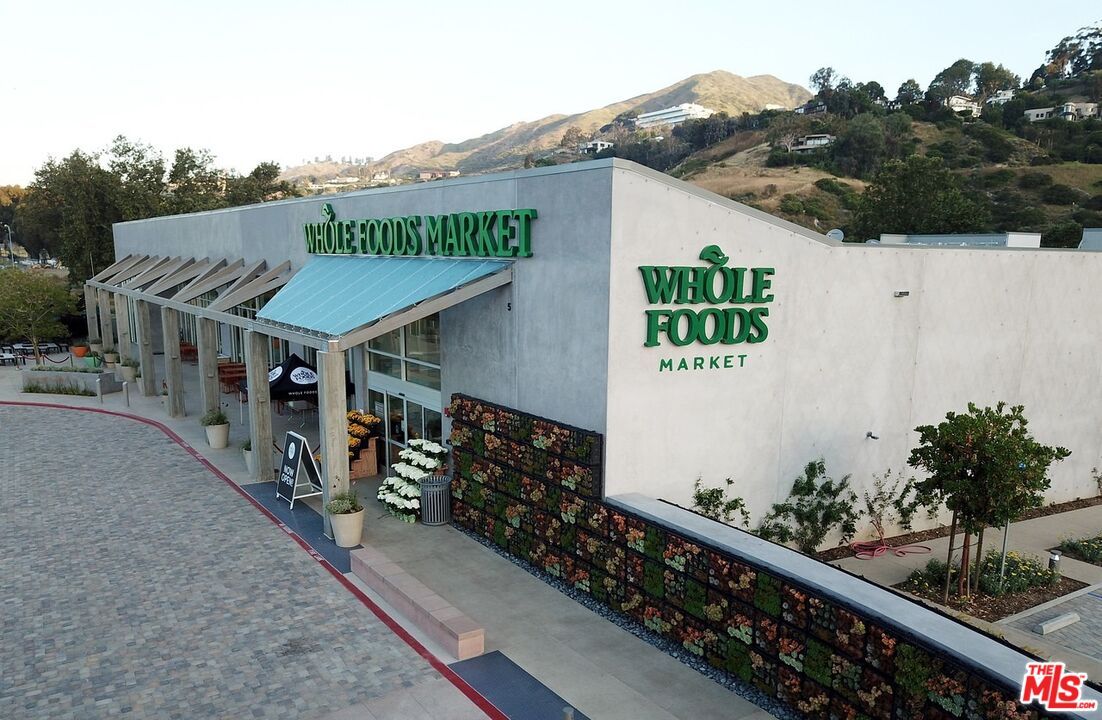 3629 Serra Road Malibu, CA 90265 - Photo 25 of 26 a view of a house with wooden fence