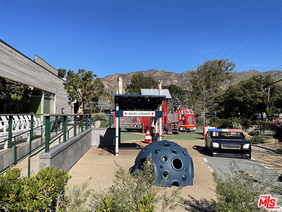 3629 Serra Road Malibu, CA 90265 - Photo 26 of 26 a view of outdoor space with deck and car parked